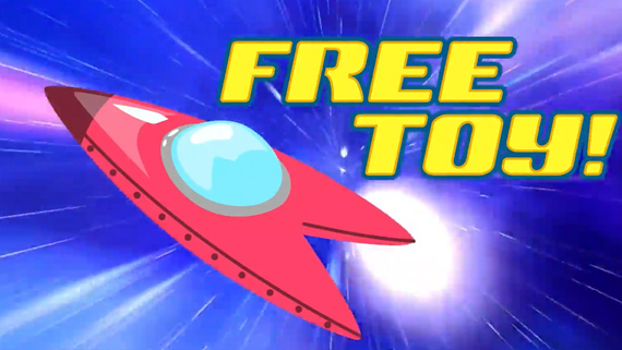 An image from the Space Puffs cereal video of a toy spaceship and the words "FREE TOY!" in big, bold letters floating in space