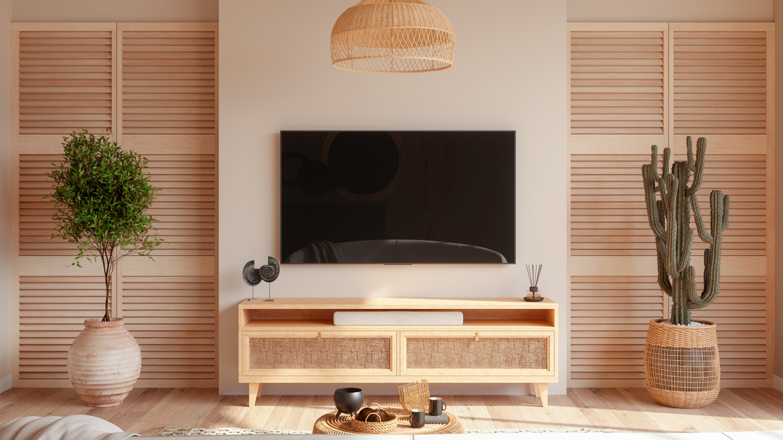 A television mounted on a wall in a cozy living room