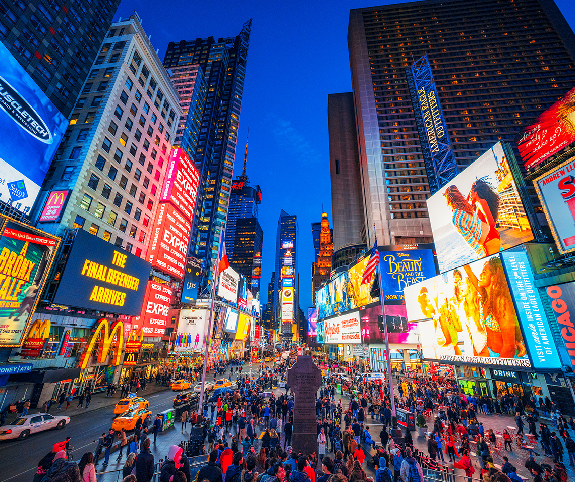 Time Square in New York City, displaying bright and bold billboards and advertisements.
