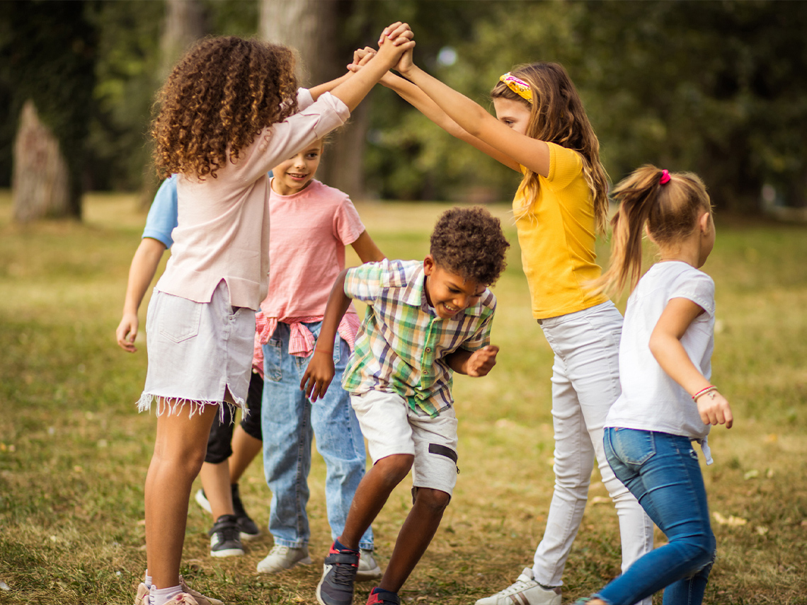 A group of children playing with each other outside.