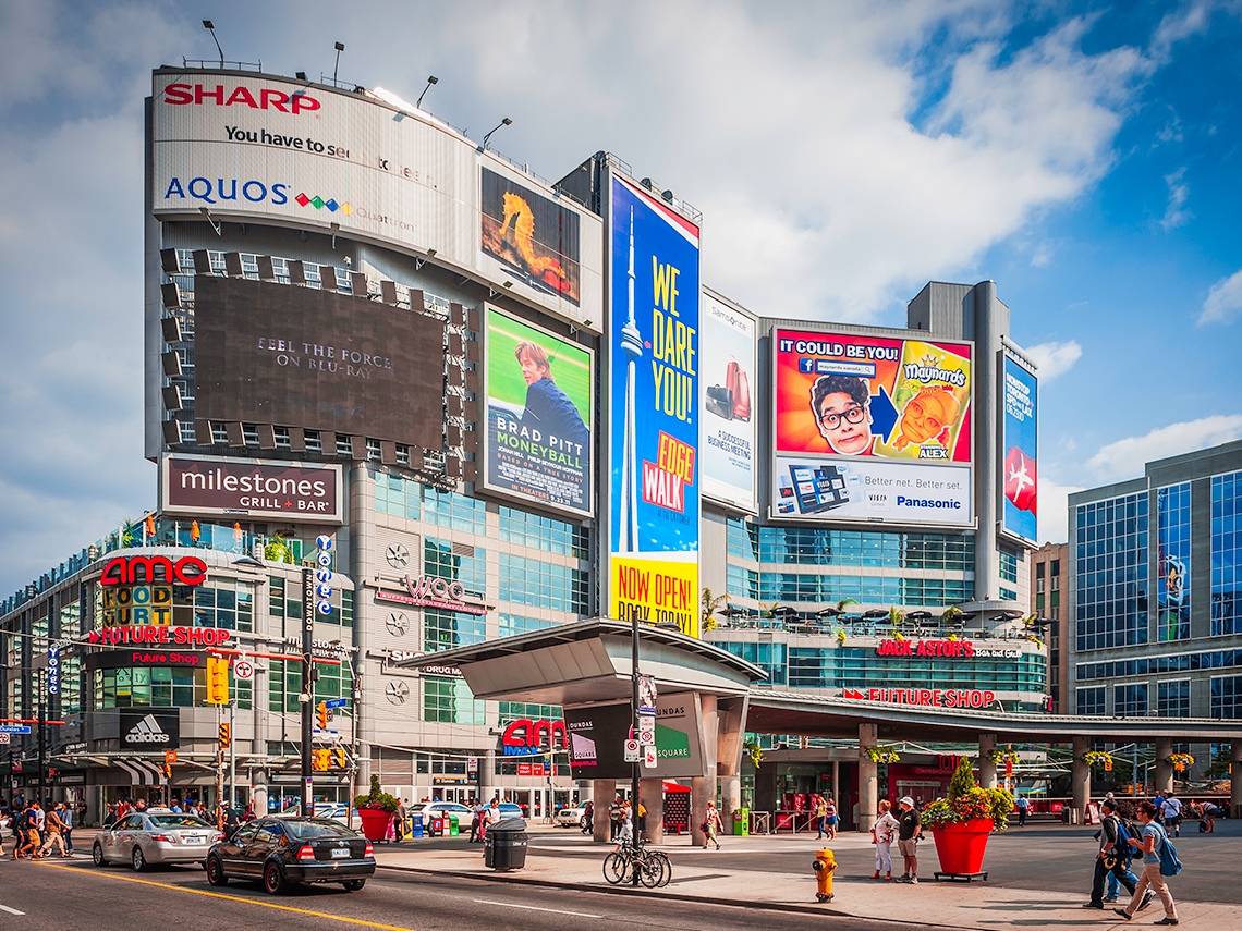 Various billboards that are being shown in downtown Toronto.