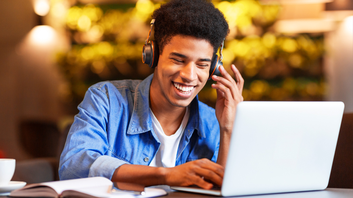 Teenager on a laptop.