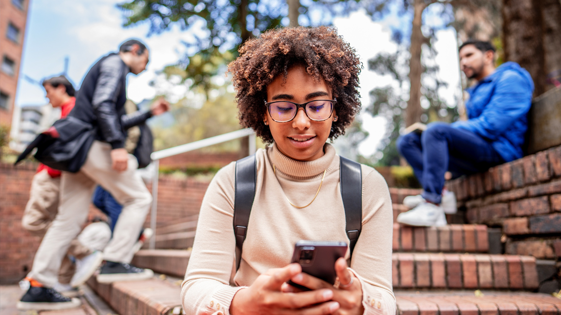 A teenager looking at her phone.