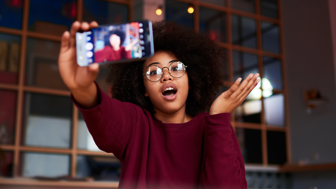 A teenager taking a selfie.