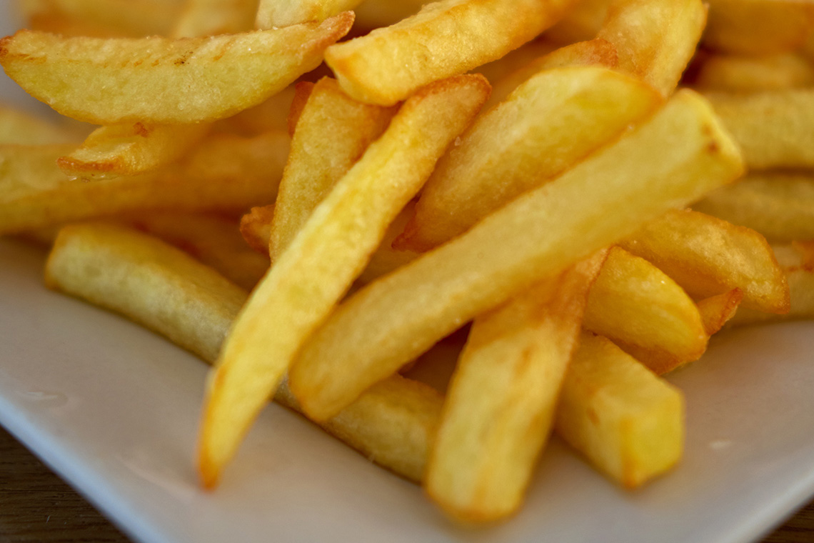 A plate of french fries.