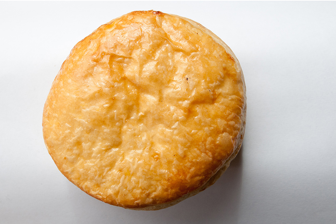 A small, round piece of fried bread dough.