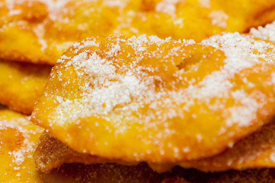 A beavertail pastry coated with sugar and cinnamon.