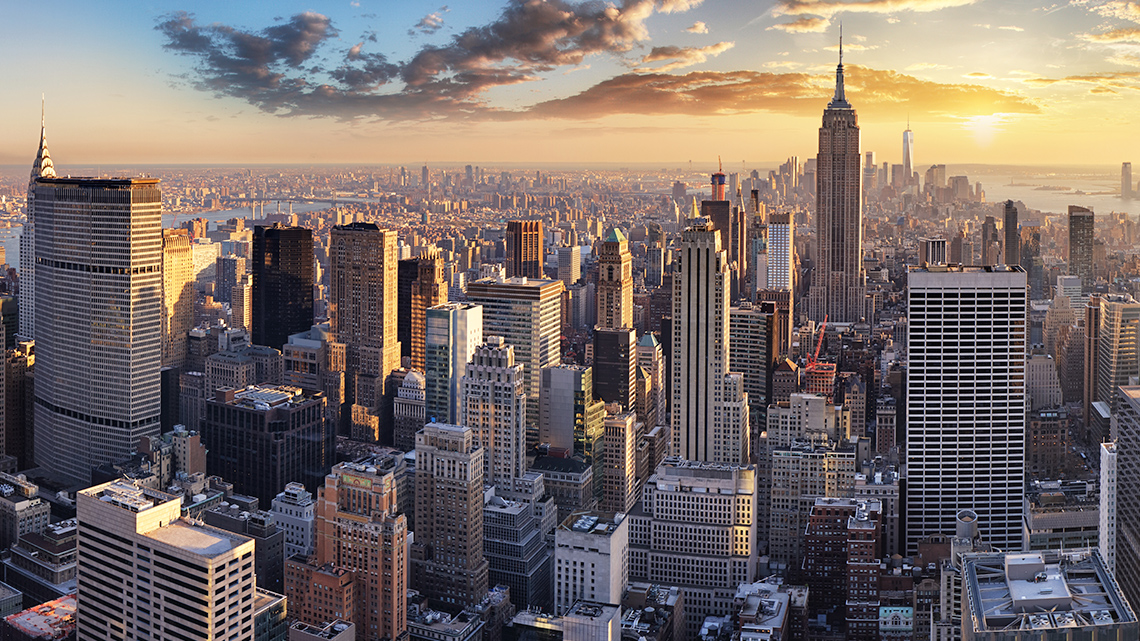 The Settlement of New York City A view of the New York City skyline with skyscrapers and buildings packed together.
