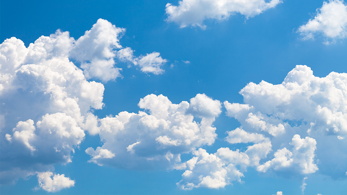 Air An image of a blue sky with white clouds.