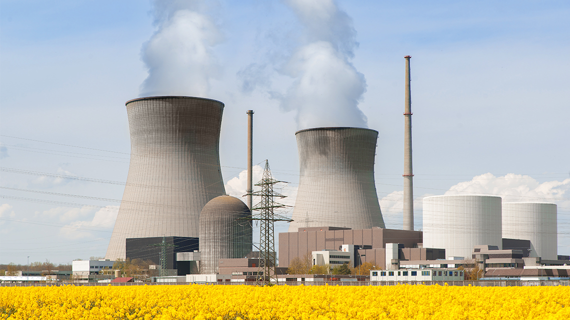 Nuclear Power Plant A nuclear power plant in an open field, with distinctive cylindrical cooling towers.