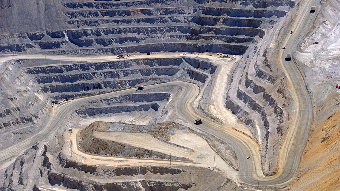 Walls of soil have been mined deep into the ground.