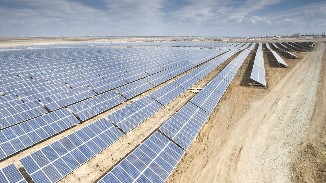 The image shows many rows of solar power panels.