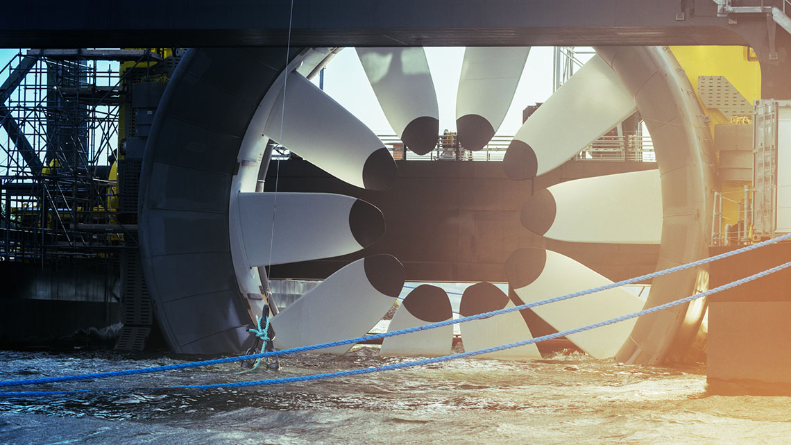 The blades on a tidal generator move with the tide, producing zero-carbon energy.