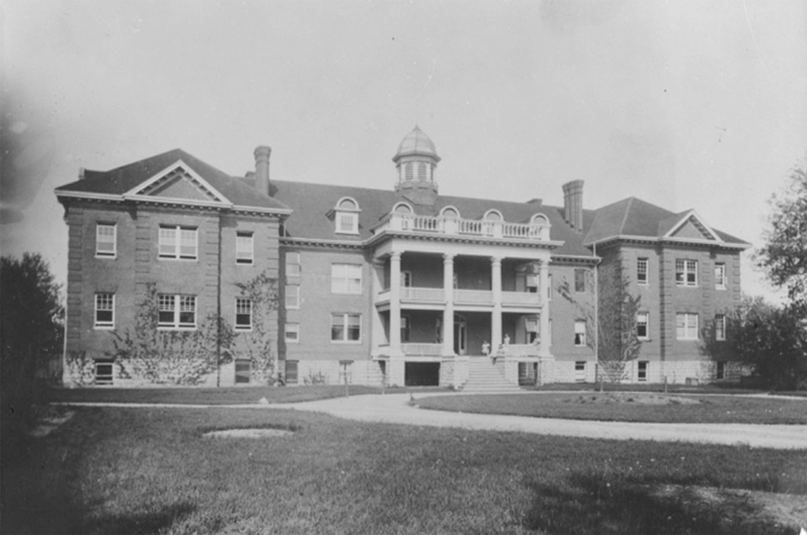 A photograph of Mohawk Institute. It is a big building with many windows and balconies.