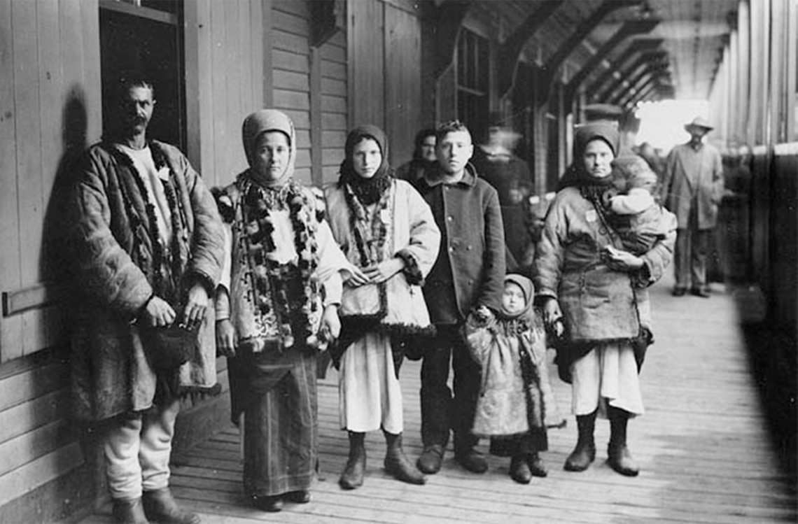 A family of Ukrainian immigrants from 1911 standing in a railway tunnel in Quebec.