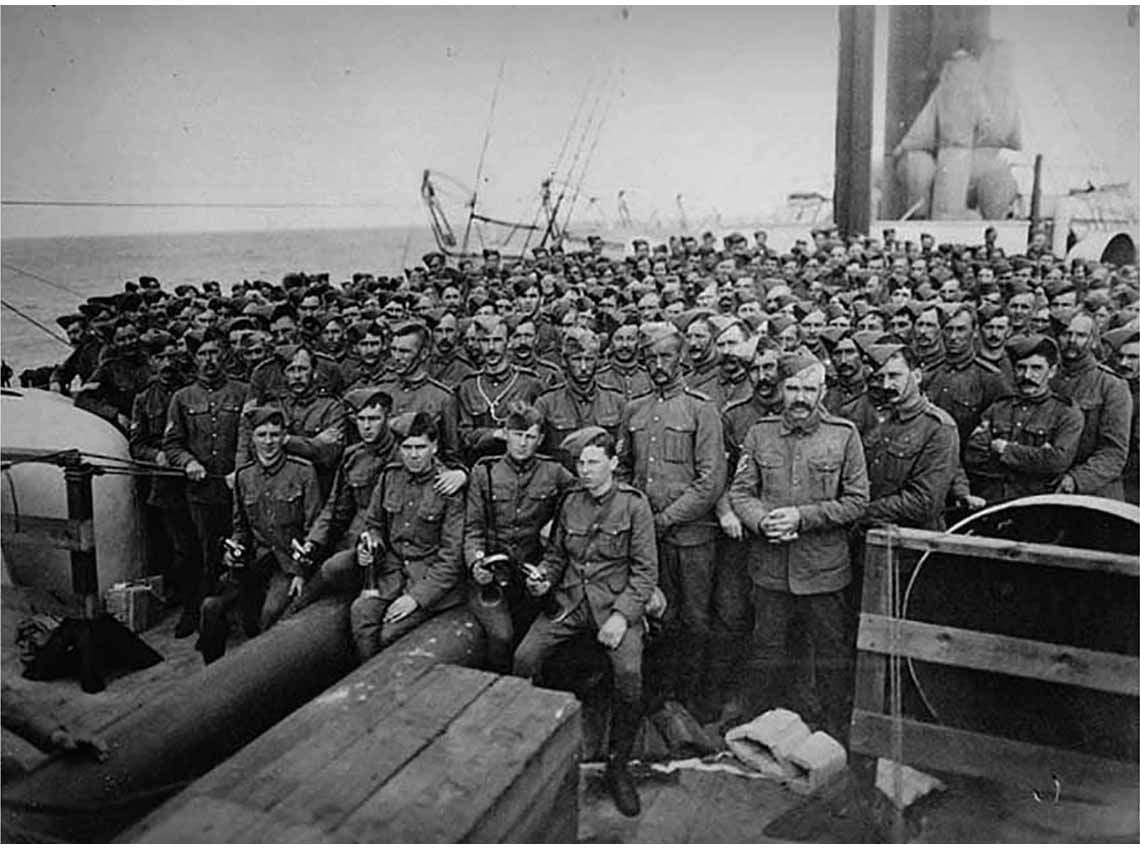 This is an image of thousands of men in uniforms waiting to board a ship.