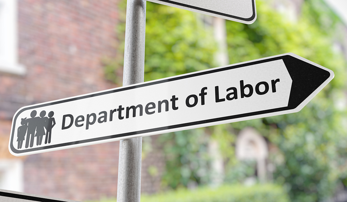 An image of a road sign that reads, 'Department of Labor' and points to the right.