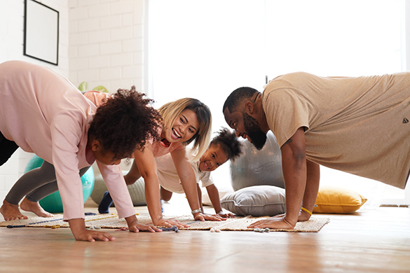 Exercising Indoors A family is exercising together at home.