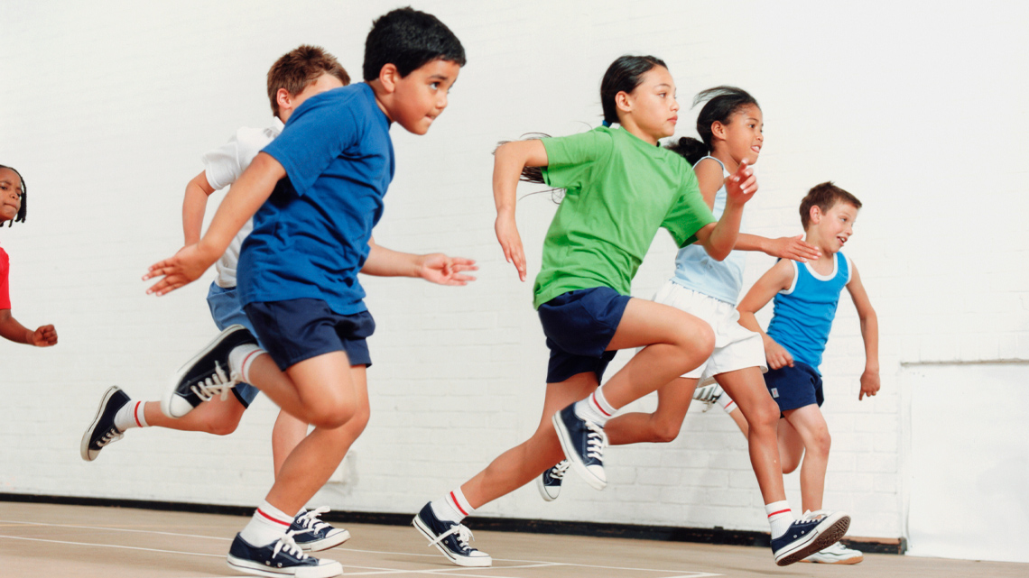 Children racing in the gym.