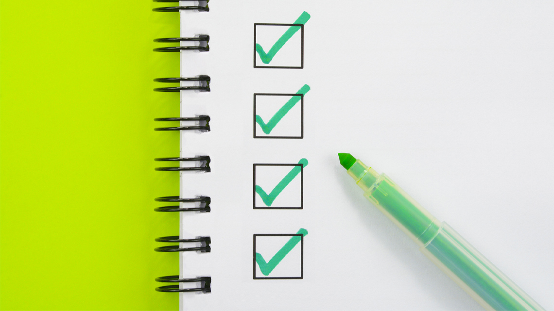 A checklist and a green pen