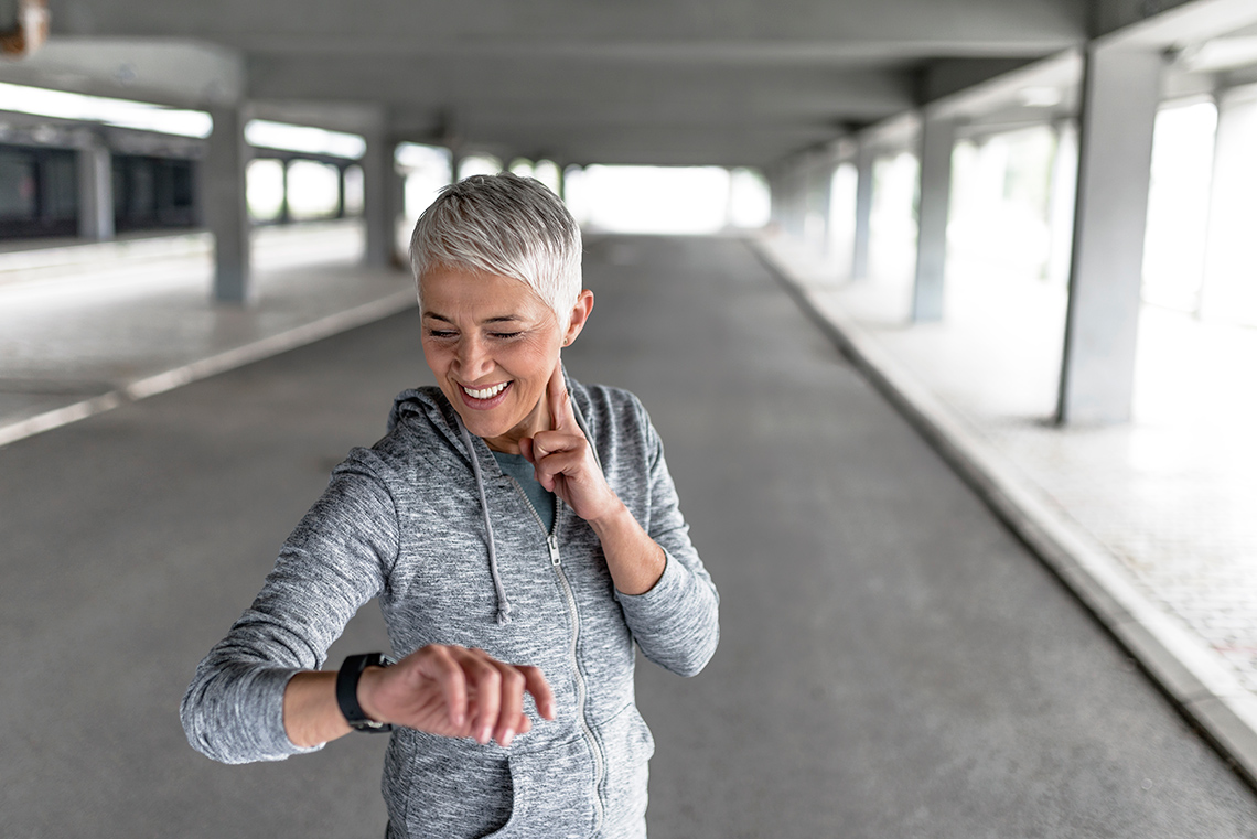 An active person checks their pulse.