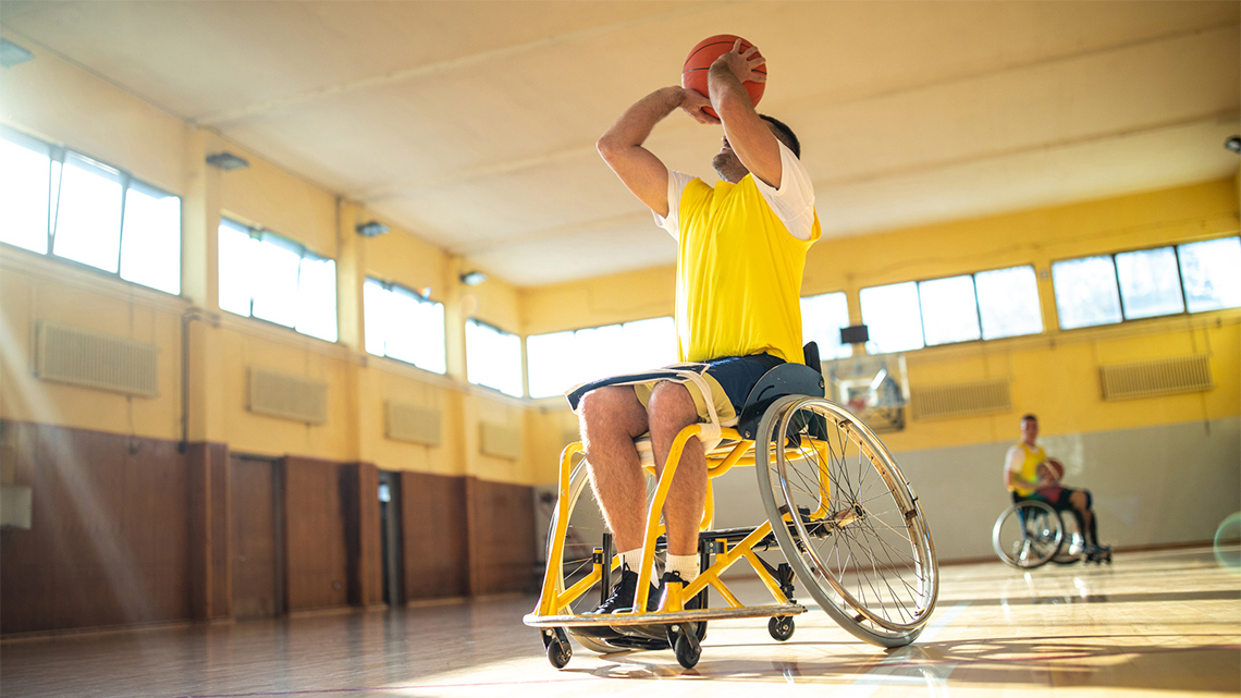 A person in a wheelchair playing basketball.