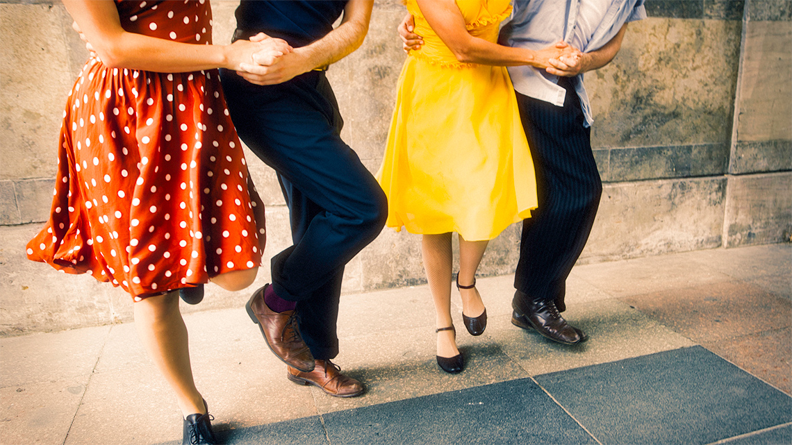 Children swing dancing in the gym.