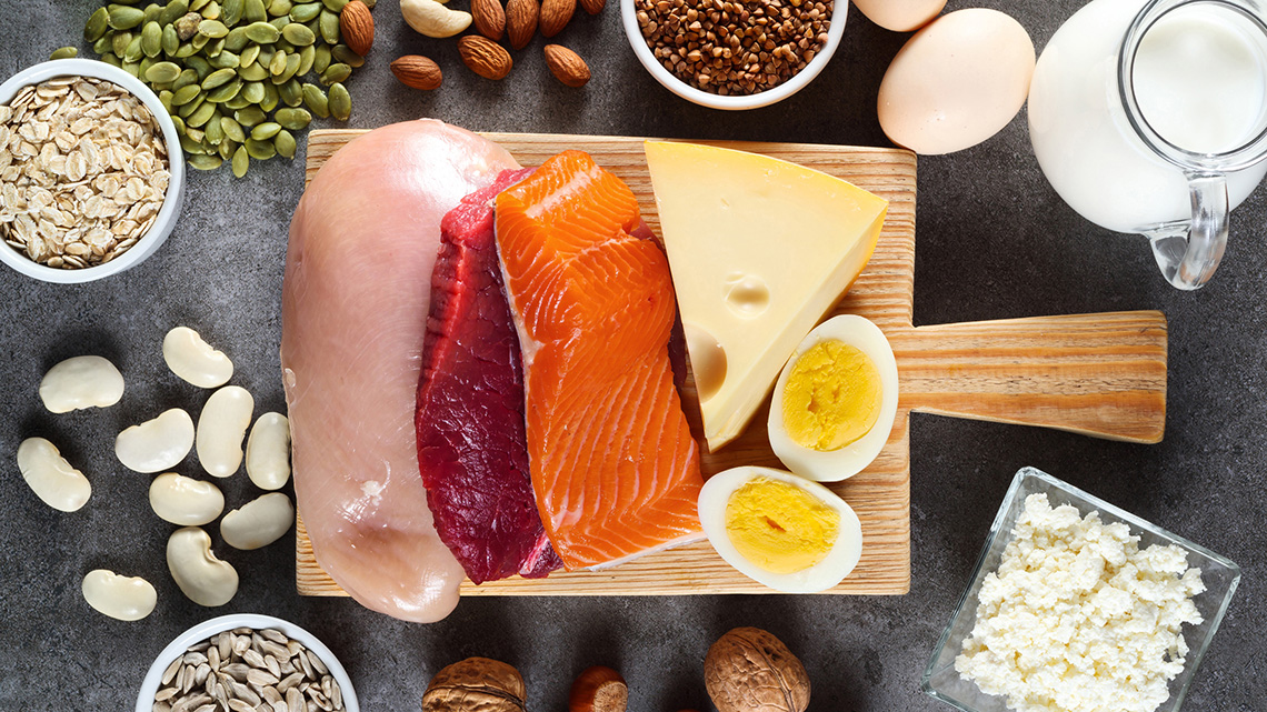 Sources of protein, including seeds, nuts, salmon, eggs, cheese, chicken, and beef.