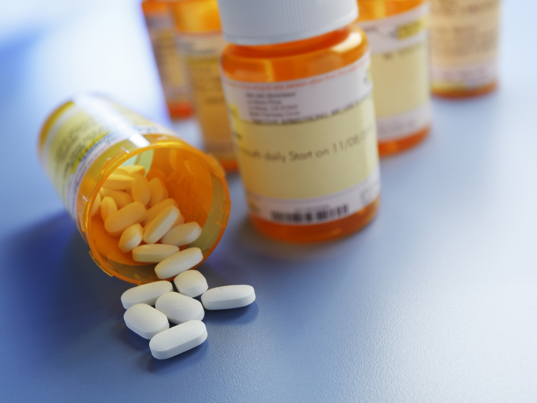 Someone’s prescription medication, with pills spilling out of the bottle.