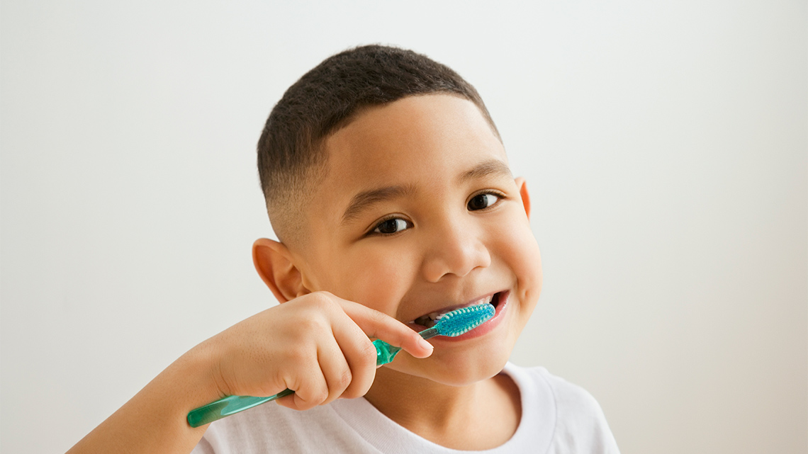 A child brushing their teeth