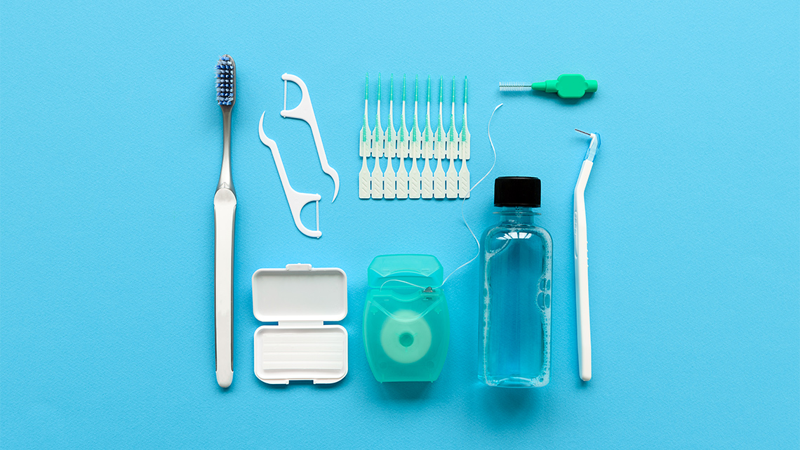 Tools used for taking care of teeth, including a toothbrush, mouth wash, toothpaste, and floss.