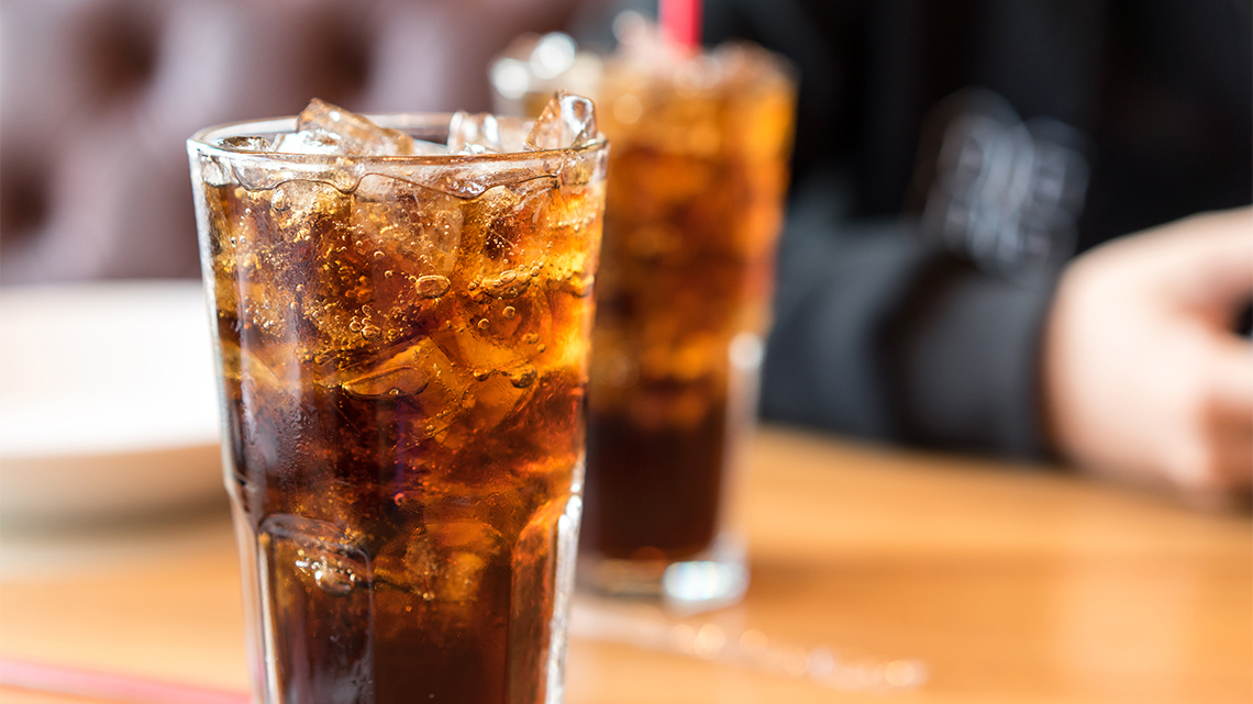 A glass of cola with ice.