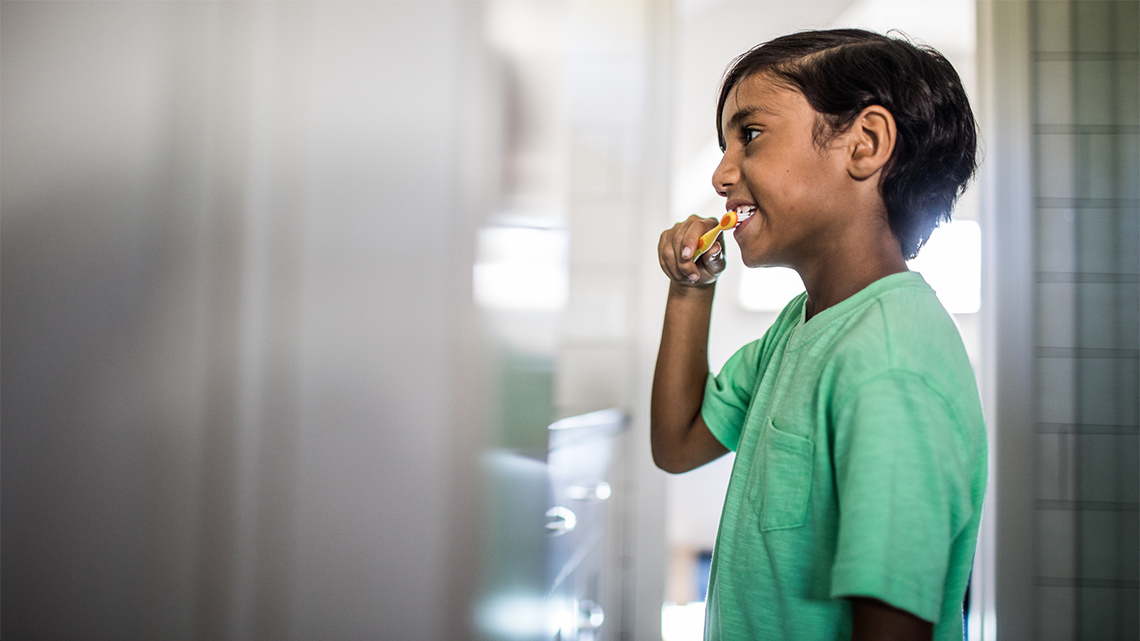 A child brushing their teeth.