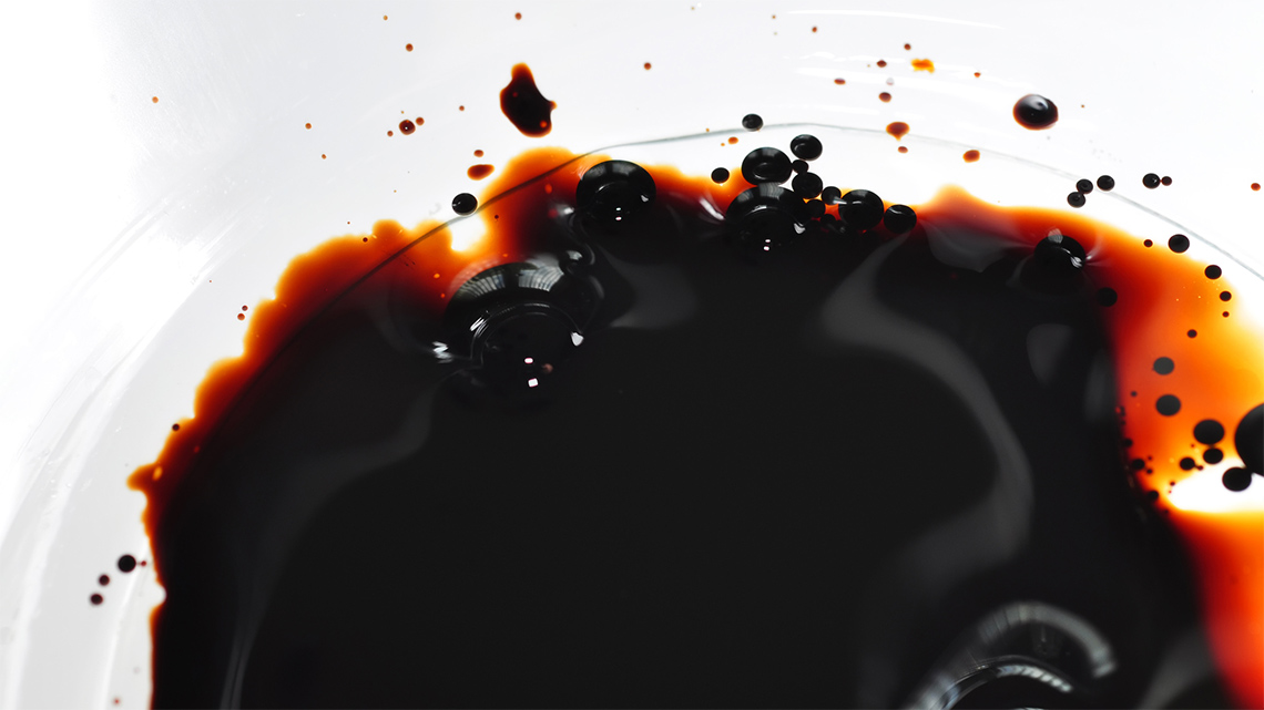 A thick and dark puddle of tar.