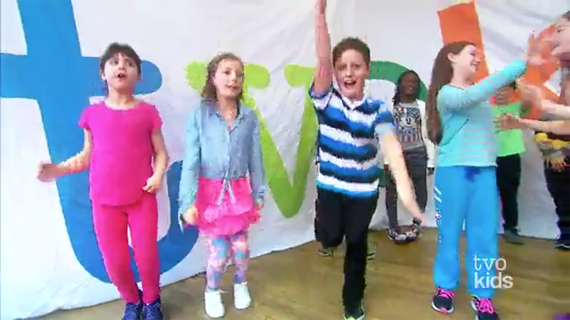 A group of children are dancing.