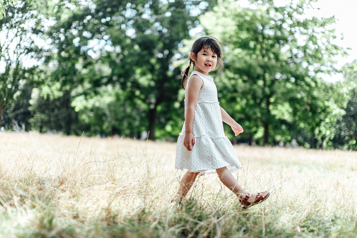 A child is walking forward.