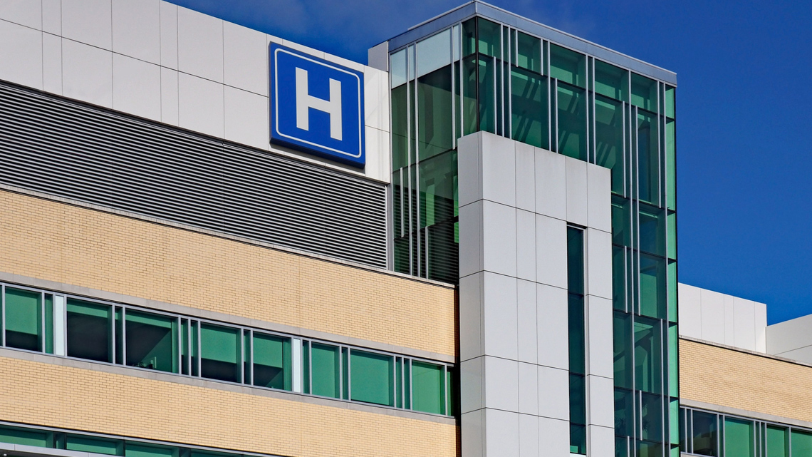 A large building. The building has the letter ‘H’ on a sign on the top of it.