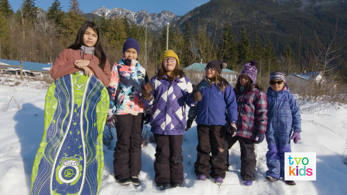 Natalya and Adriana are outside in the snow with their friends.