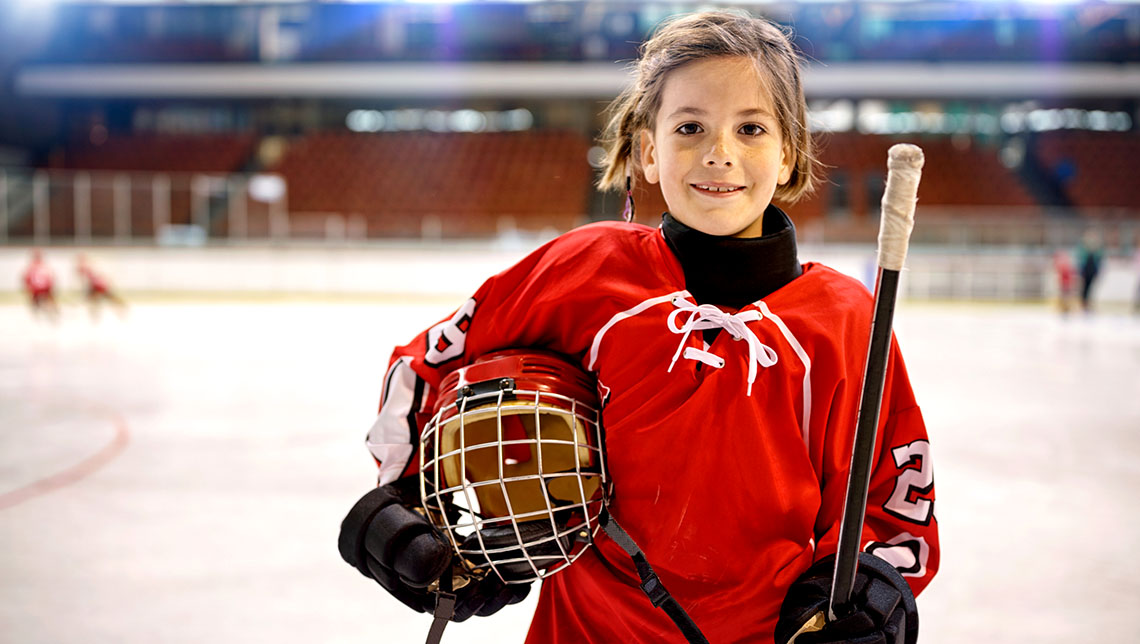 Kid on ice in hockey gear