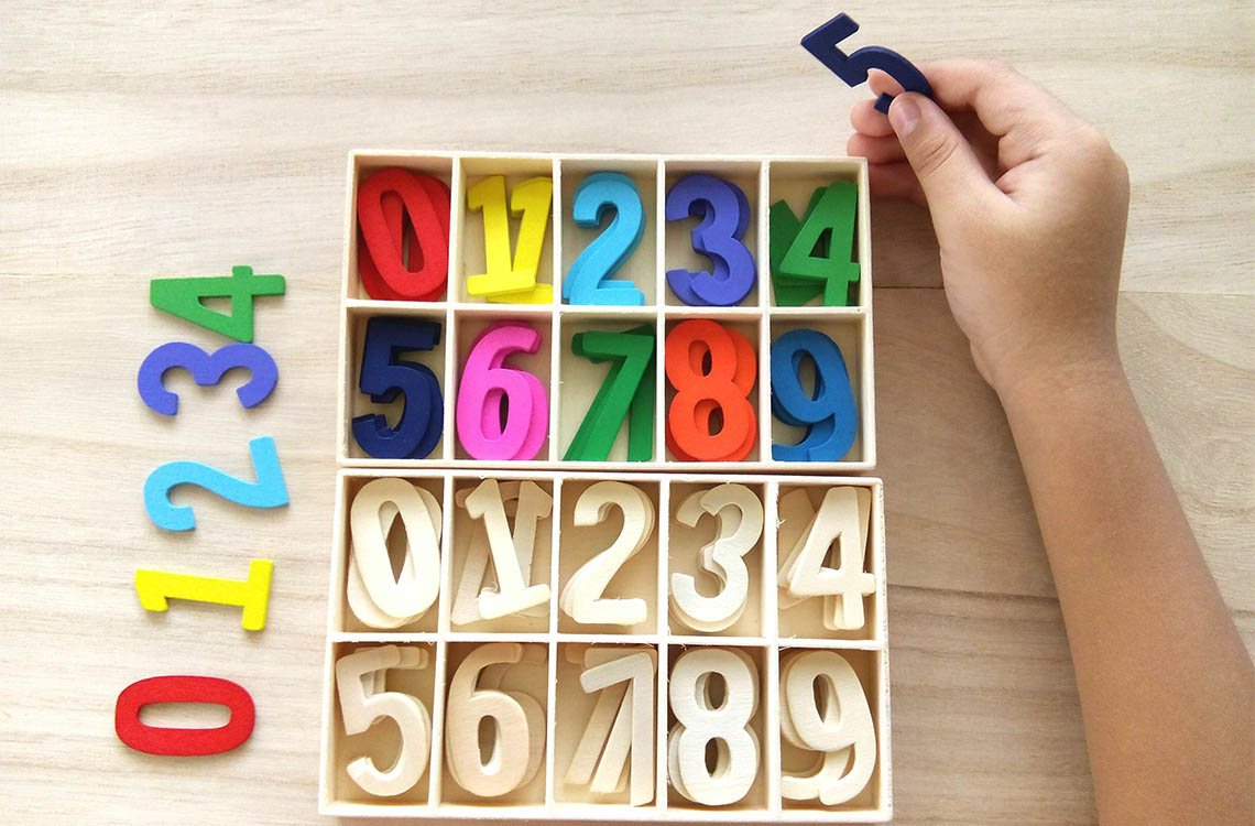 A box of wooden numbers.