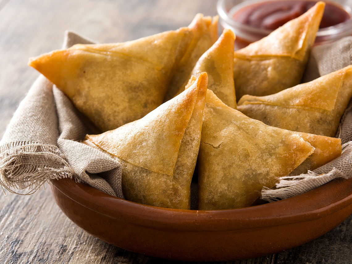 A bowl of samosas.