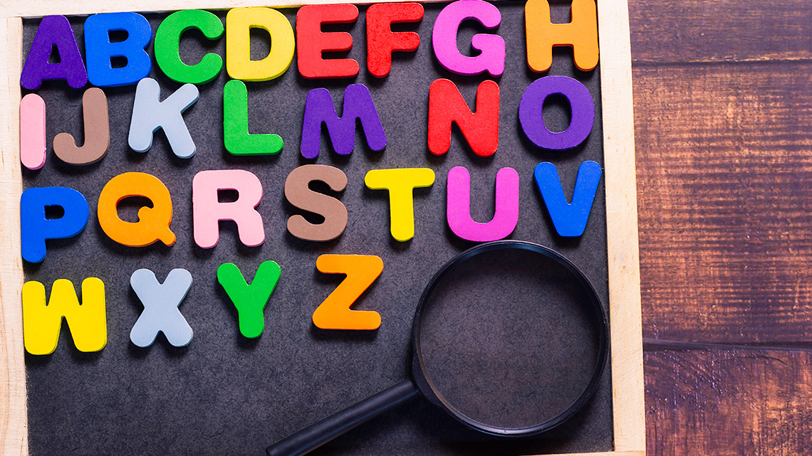 Colourful alphabet letters on a board.