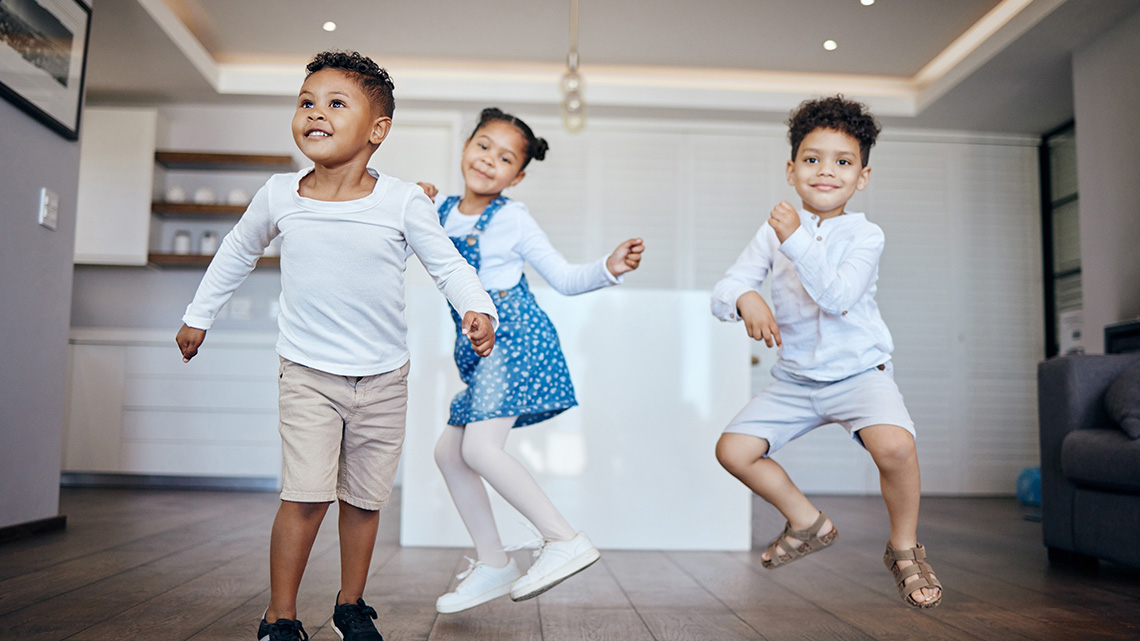 A group of young children are dancing.