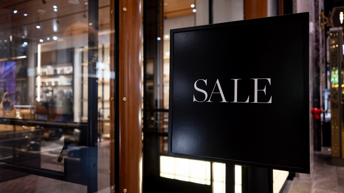 A sale sign on a storefront.