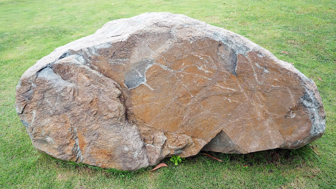 A very large, heavy, and hard oval-shaped object with a rough surface.