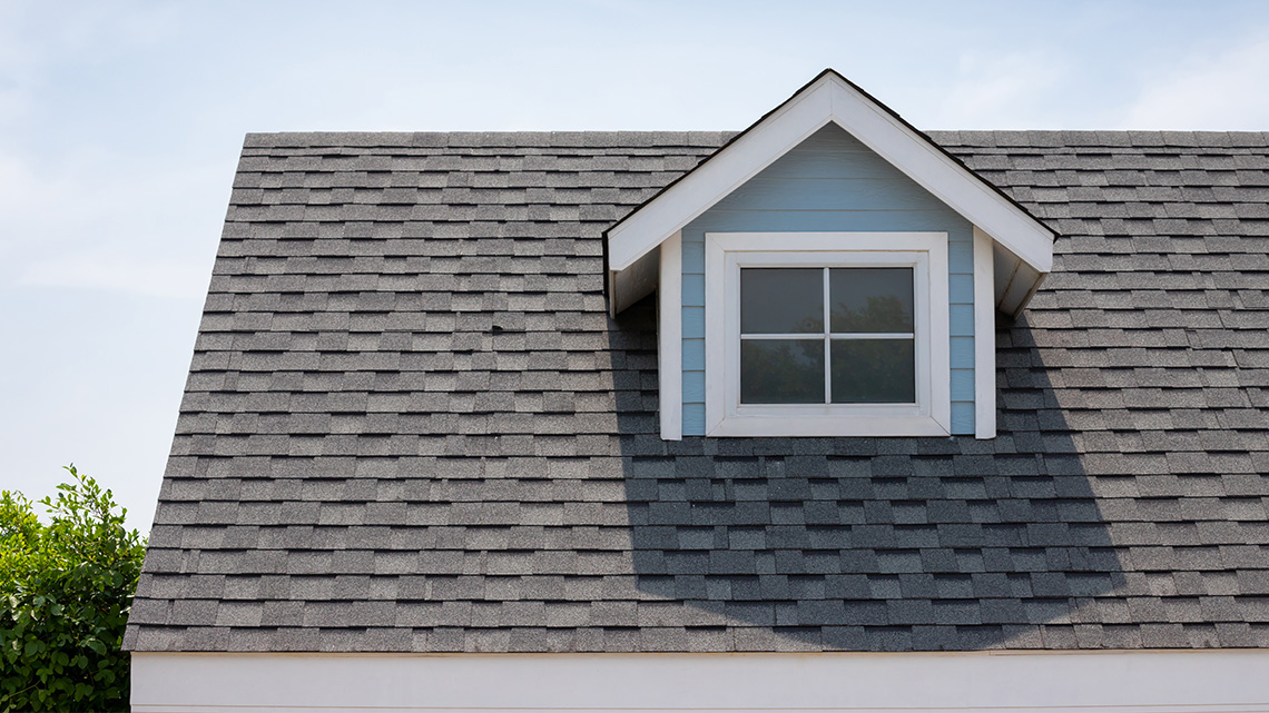 The top part of a house that has different textures and shapes.