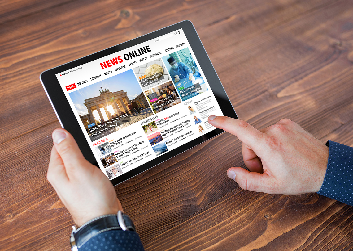 image of online news displayed on a tablet