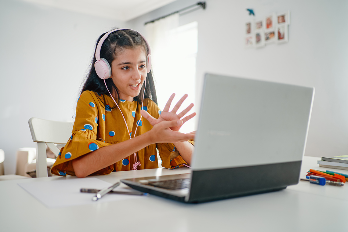 Student chatting on a laptop