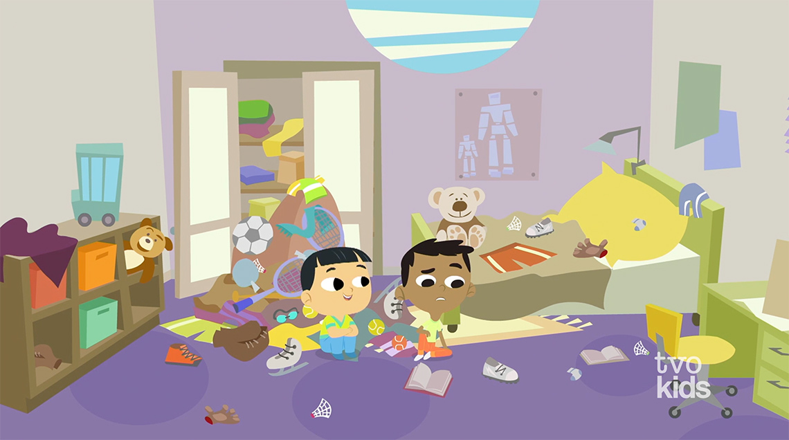 Eddie and Sam sit on the floor in Eddie’s room with clothes and things on the floor.