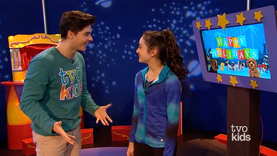 Celeste is turned towards Lucas as they speak. Both are making eye contact and Lucas gestures with their hands.